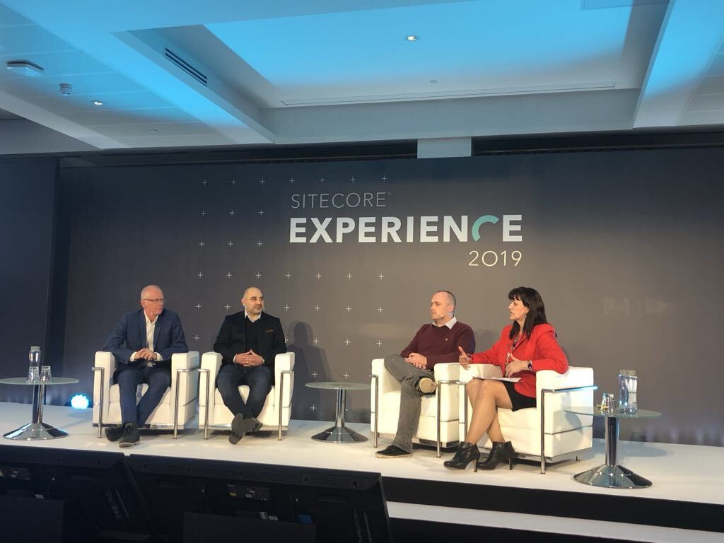 On a stage at Sitecore Experience 2019, Alison Sainsbury is facilitating a panel about GDPR and trust in digital experience
